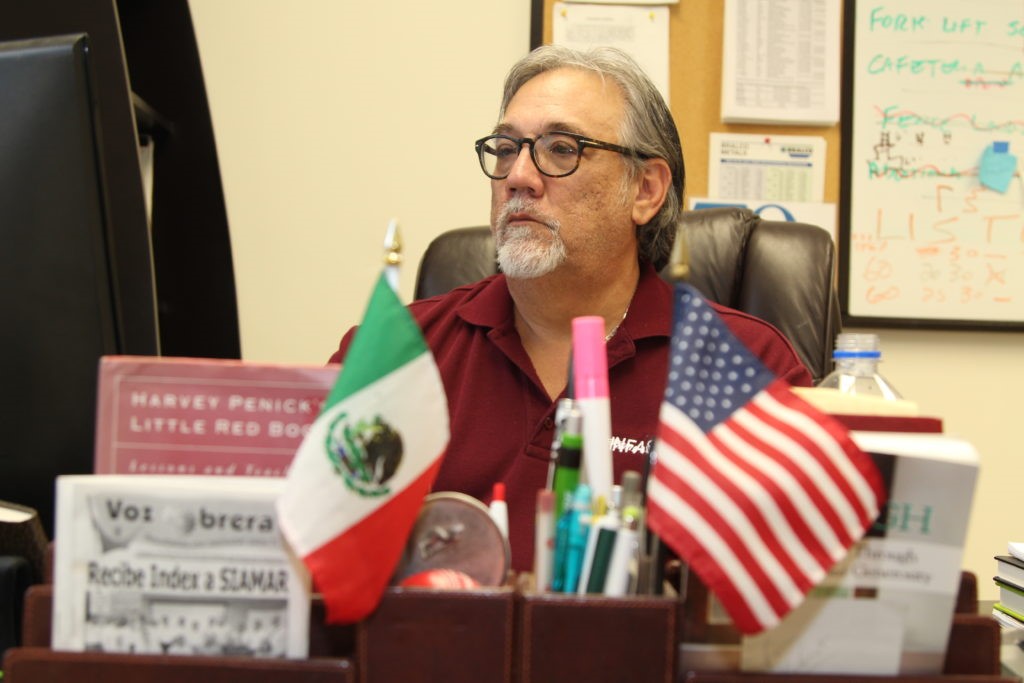 Mike Myers, a maquila manager in Reynosa, Mexico, at his desk.