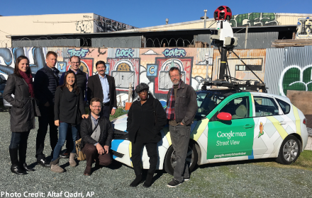 The research team poses with its specially-outfitted Google Street View car