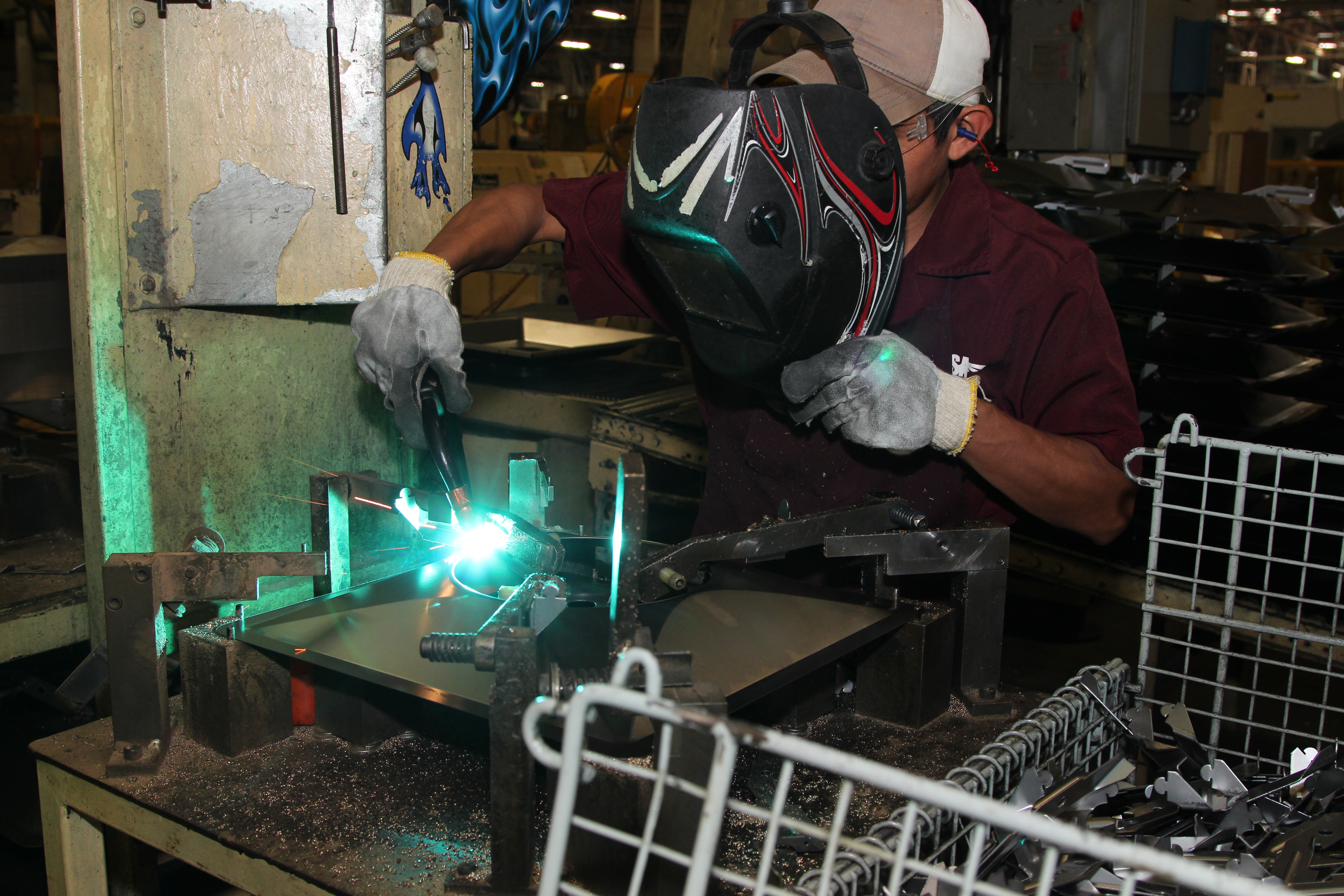 Alberto Martinez welds steel at a maquila, Reynosa, Mexico. (photo: Lorne Matalon)