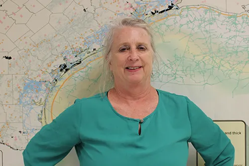 Dr. Susan D. Hovorka stands in front of a map