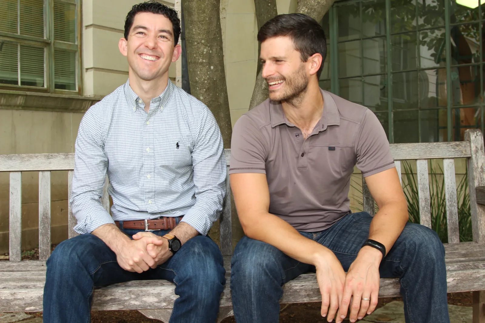 Todd Davidson and Josh Rhodes on a bench on UT campus