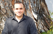 Elivan Martinez stands in front of a tree