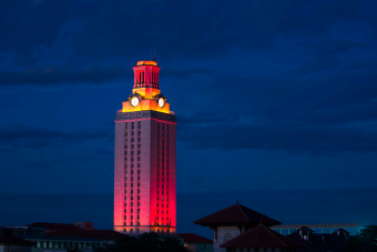 Ut Tower highlighted Orange at night