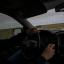 Justin Shaw drives through the Roscoe Wind Farm on March 6, 2024 in Roscoe.