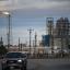 A flare burns next to a refinery along the Houston Ship Channel in Deer Park on Feb. 6, 2023. 