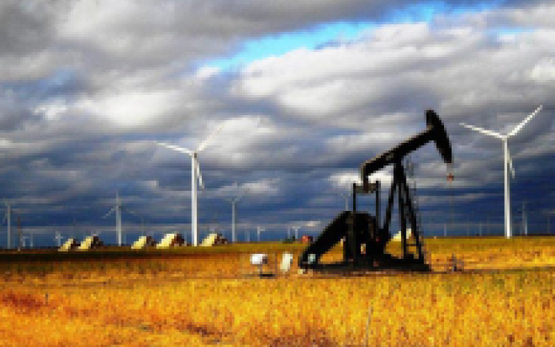 Wind turbines behind an oil pump